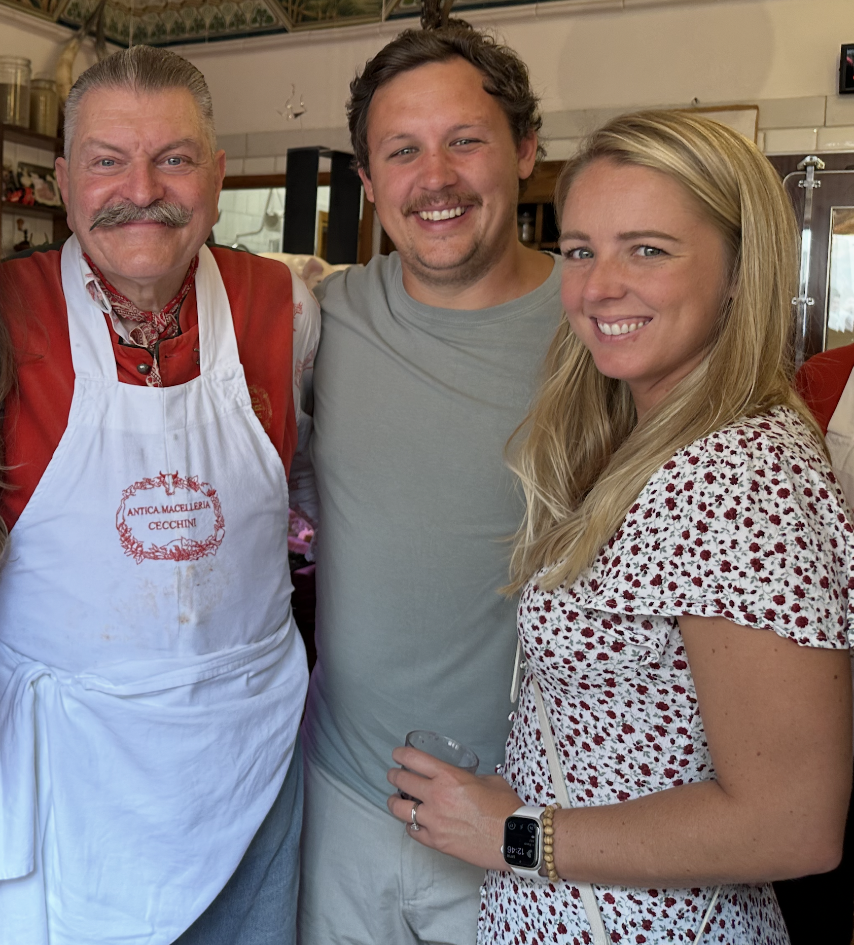 A traveler couple laughing with locals in Italy — the emotional outcome of finally connecting